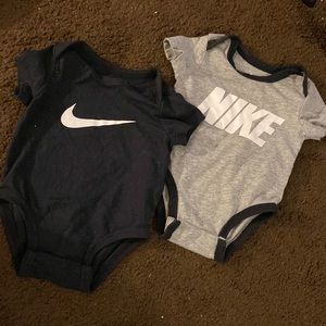 2 Nike baby onesies
